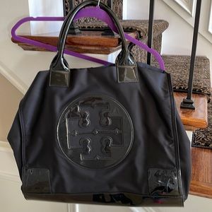 Tory Burch black tote w a few scratches and and 1 stain inside!